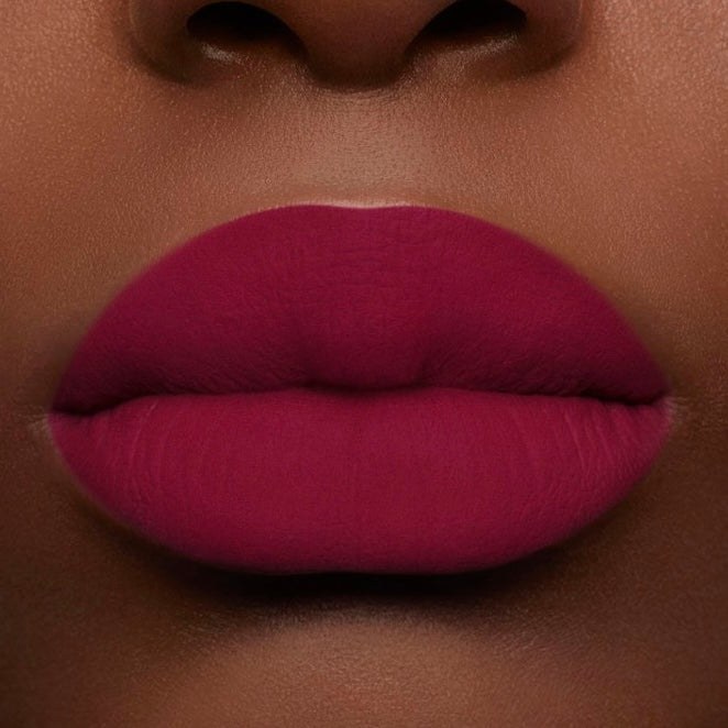 Close-up on lips of Guerlain Rouge G Velvet Lipstick N°879 Mystery Plum