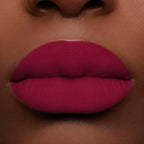 Close-up on lips of Guerlain Rouge G Velvet Lipstick N°879 Mystery Plum