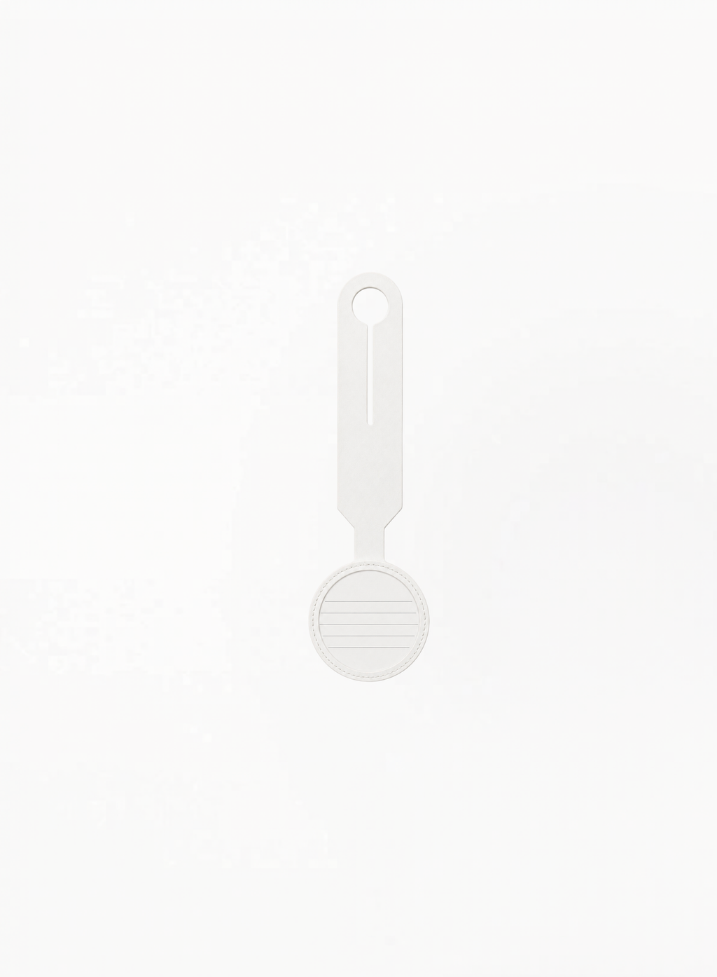 Back view of GUERLAIN white luggage tag featuring card holder details on a clean light background.