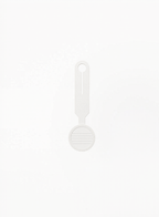 Back view of GUERLAIN white luggage tag featuring card holder details on a clean light background.