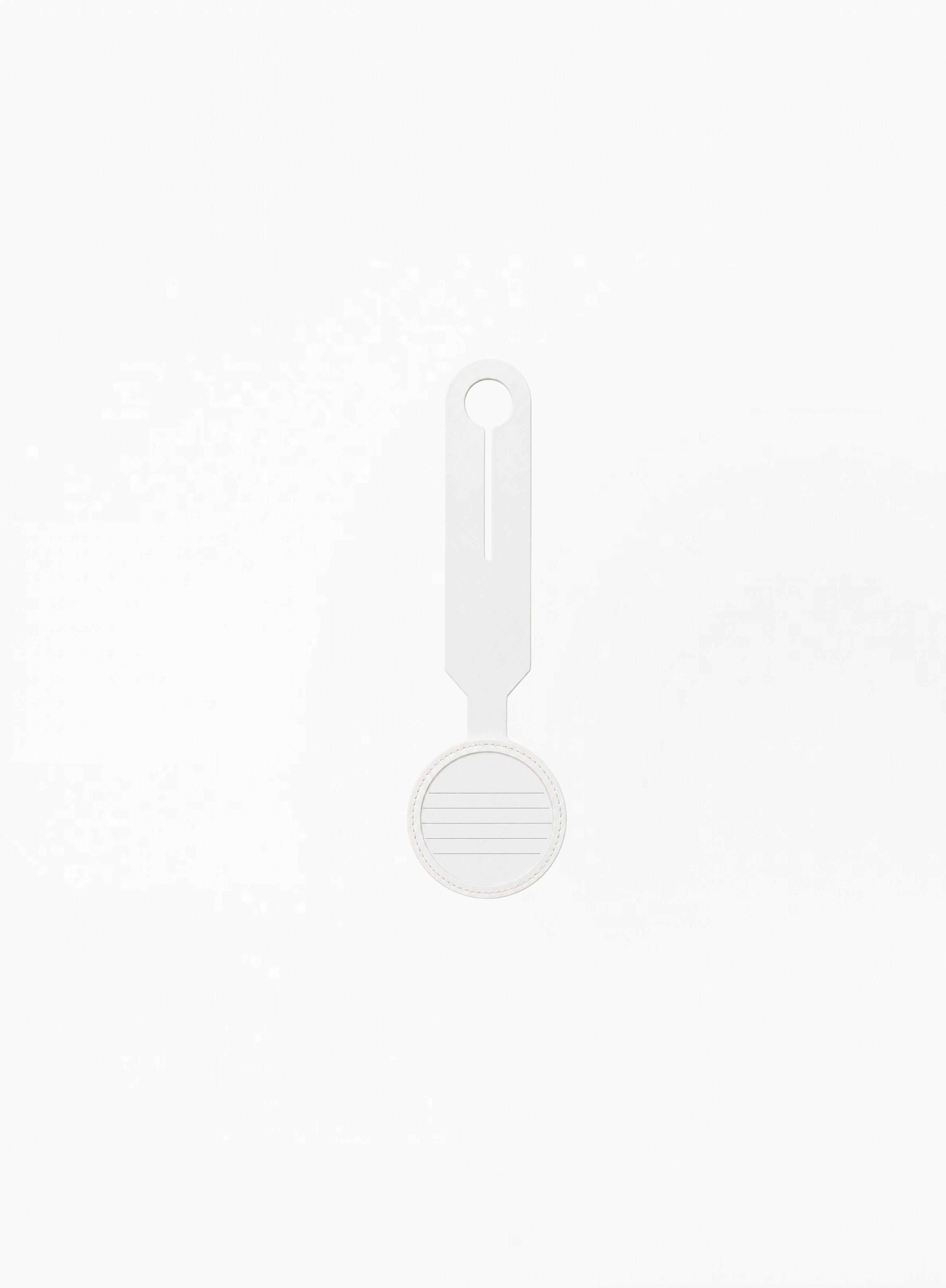 Back view of GUERLAIN white luggage tag featuring card holder details on a clean light background.