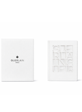 Guerlain limited edition white notebook with embossed cover and logo on white background