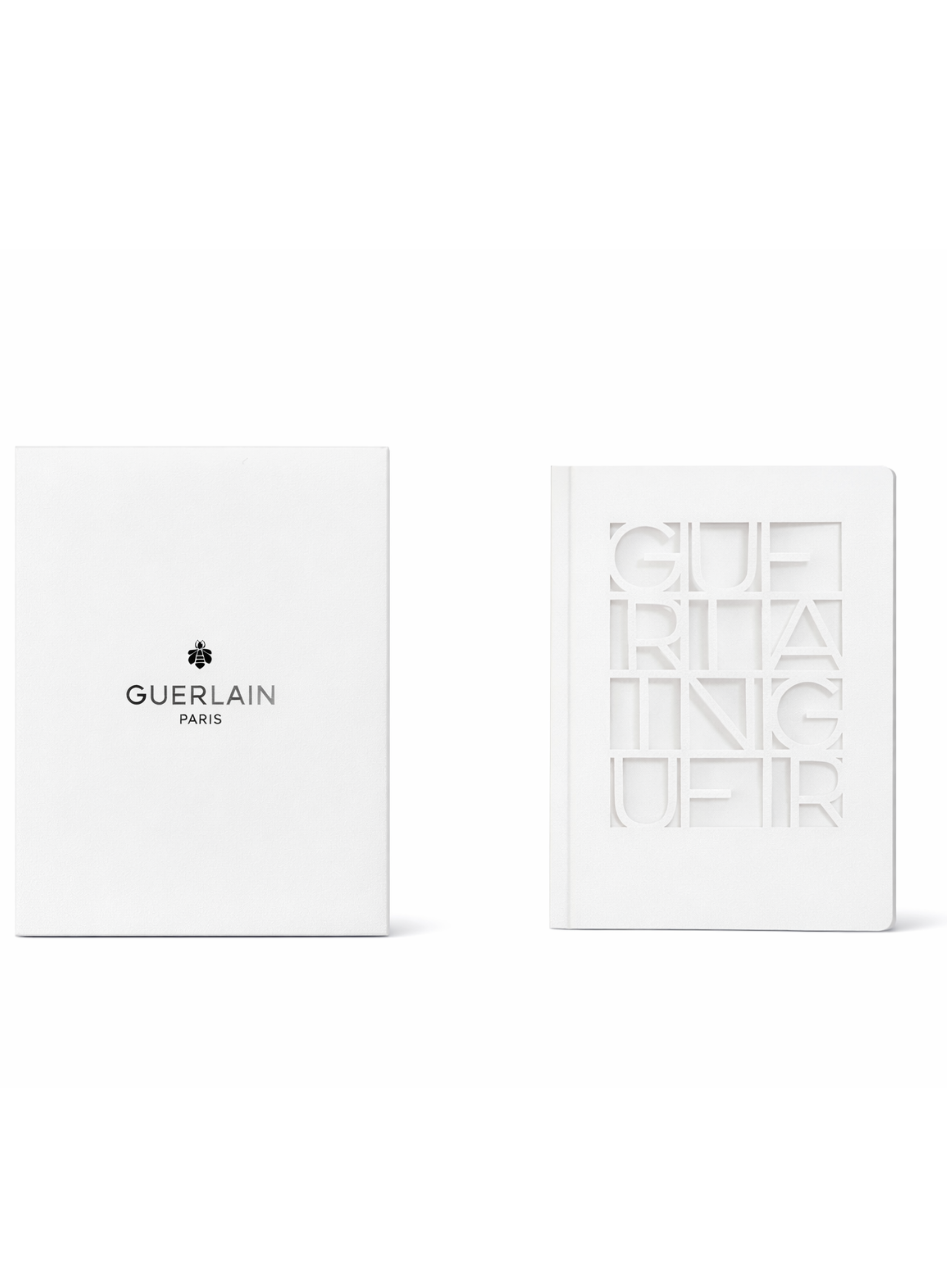 Guerlain limited edition white notebook with embossed cover and logo on white background