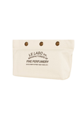 Beige pouch with 'Le Labo' branding on a white background