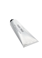 Close-up angled view of BYREDO Yuzu Tree Hand and Nail Cream 50ML in metallic silver tube packaging.