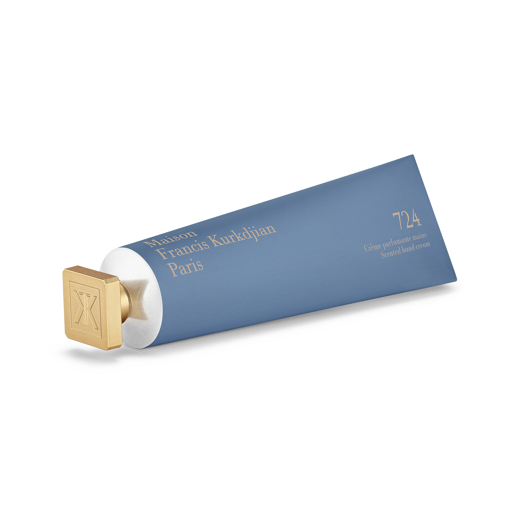 Maison Francis Kurkdjian 724 scented hand cream in blue tube with gold cap, horizontal view on transparent background