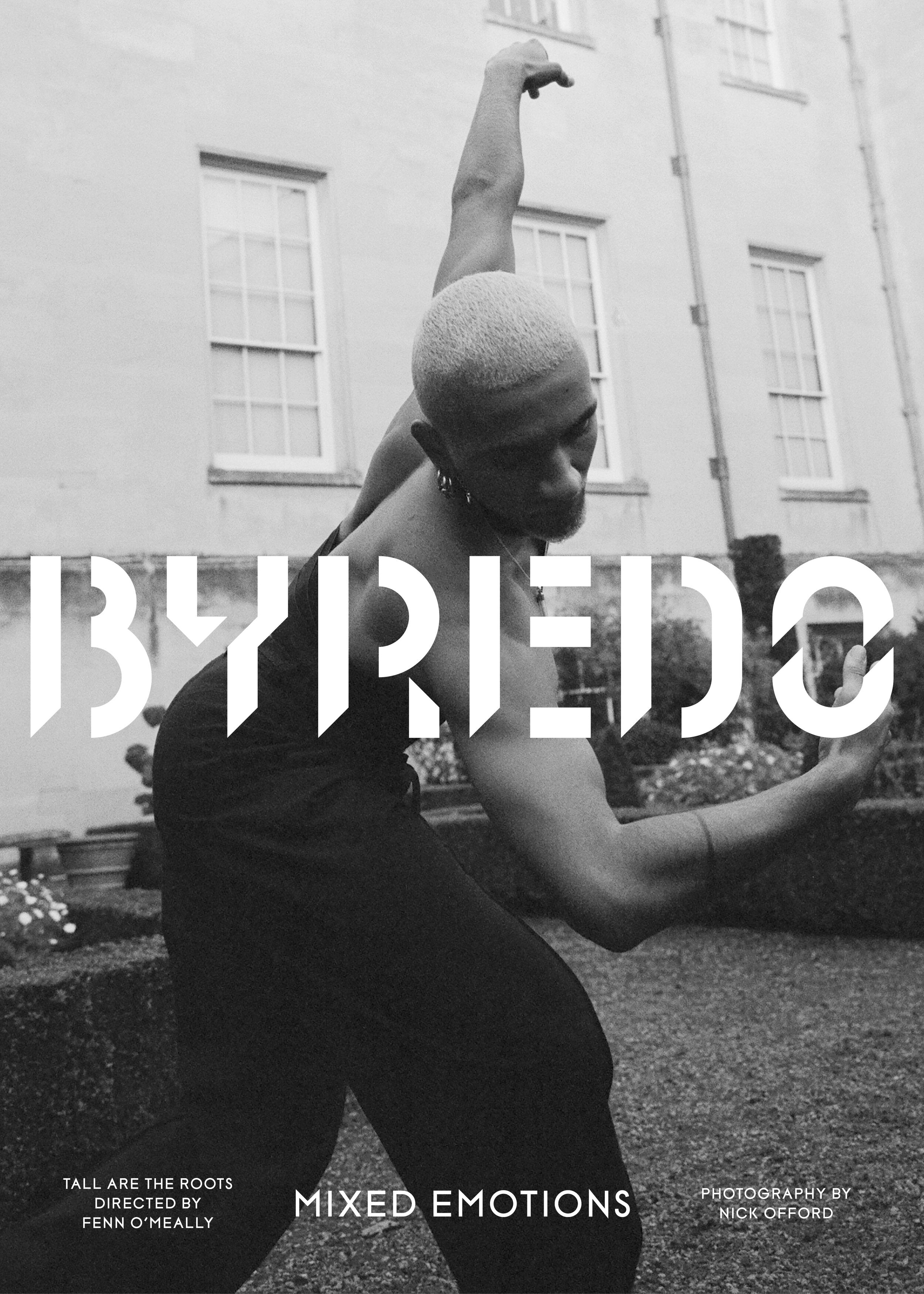 Person in a black dress dancing outdoors with 'Byredo' branding.