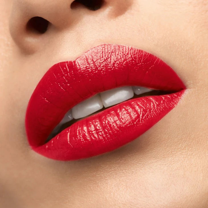 Close-up of lips wearing CHRISTIAN LOUBOUTIN 003G Mundo Red lipstick with a luminous satin finish.