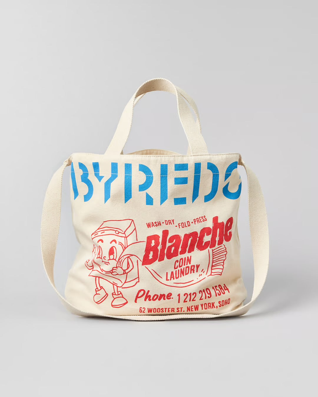 Tote bag with vintage-style design featuring text and a cartoon character on a gray background