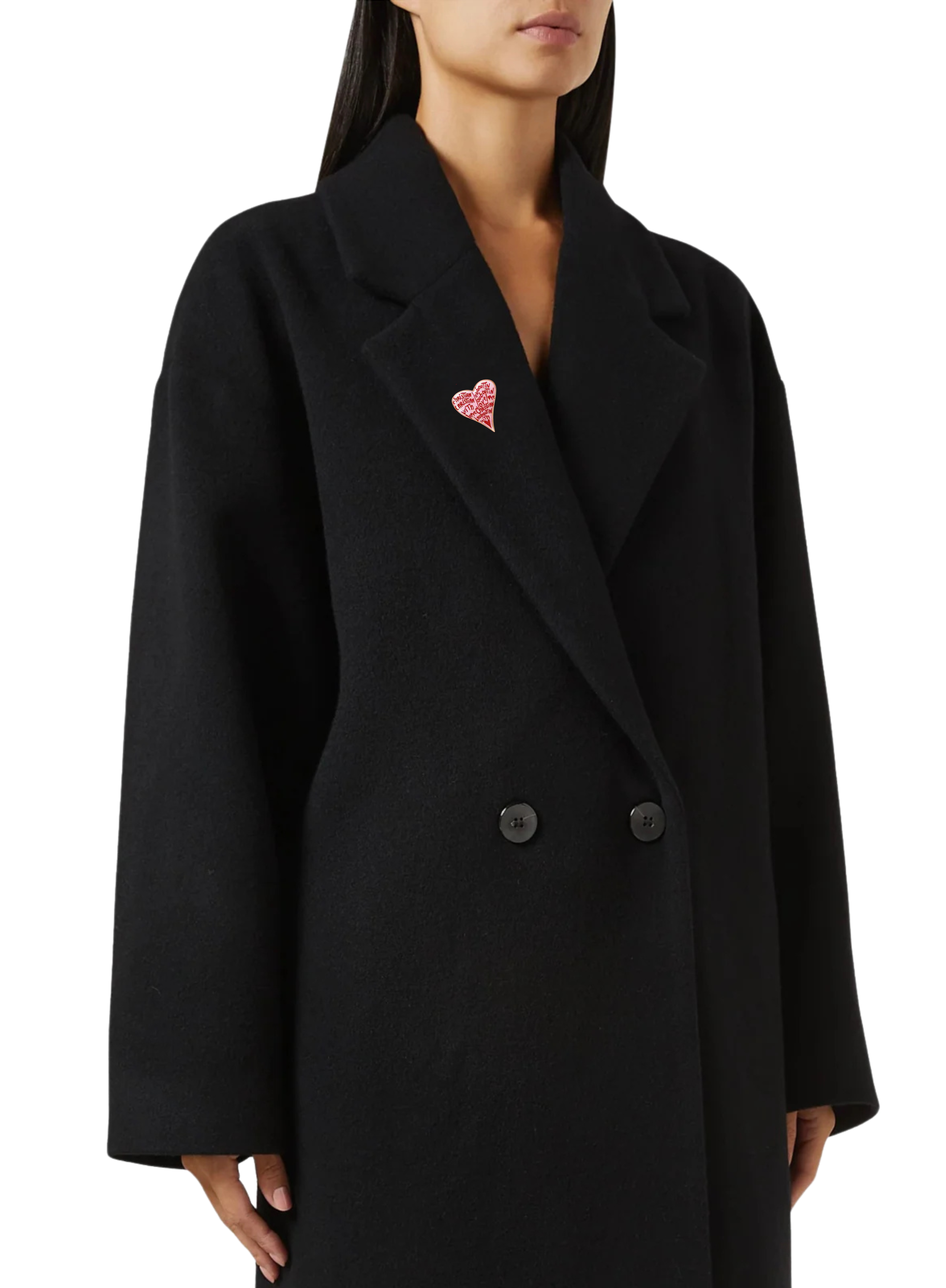 Black coat with a pink heart brooch worn by a person on a white background