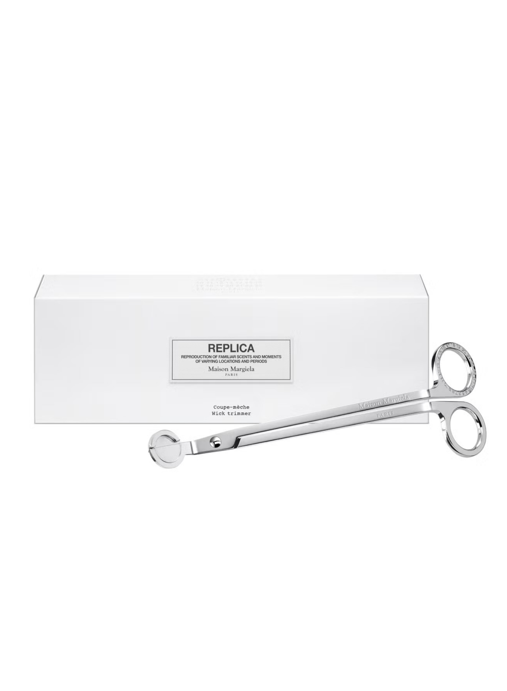 Silver scissors with a white box labeled 'Replica' on a white background
