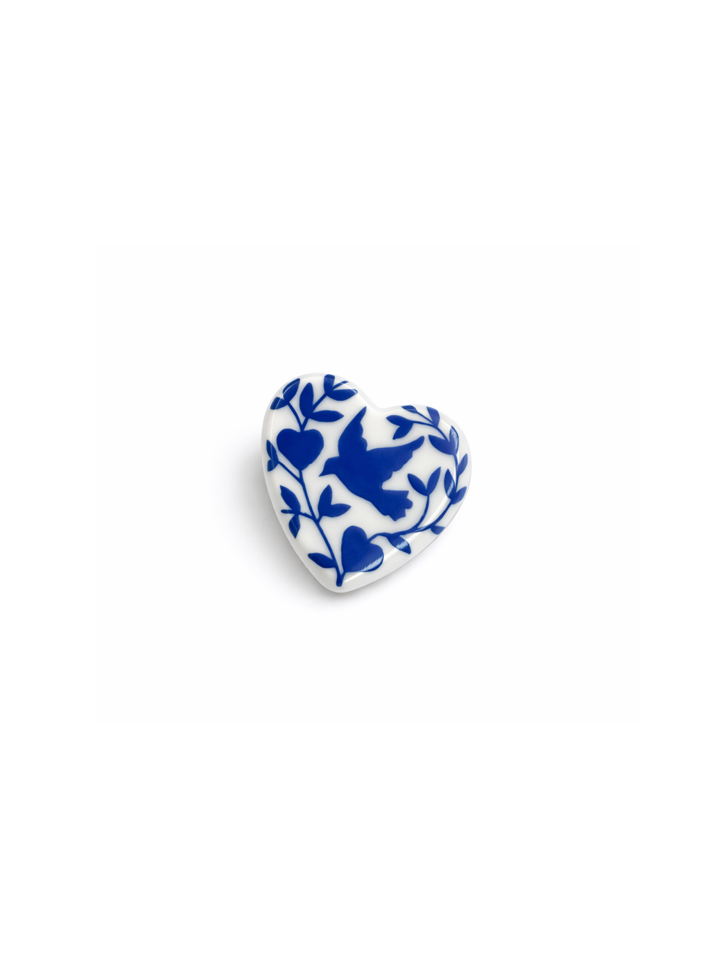 Diptyque porcelain heart brooch, limited edition, white ceramic with delicate blue illustration on white background
