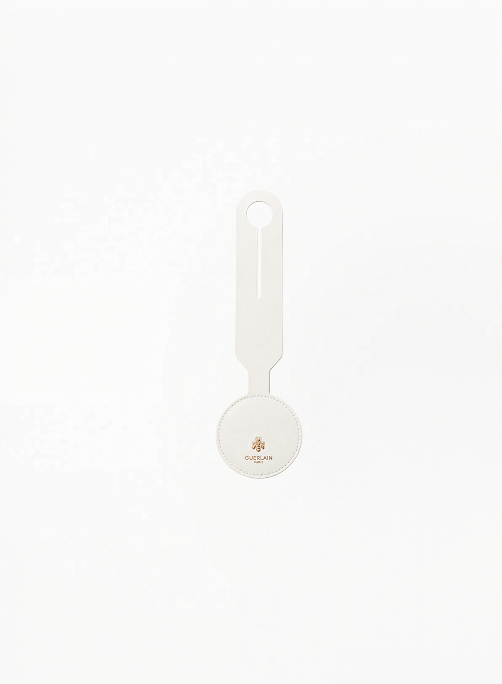 Front view of GUERLAIN white luggage tag featuring Golden bee logo and brand name Guerlain Paris on a clean light background.