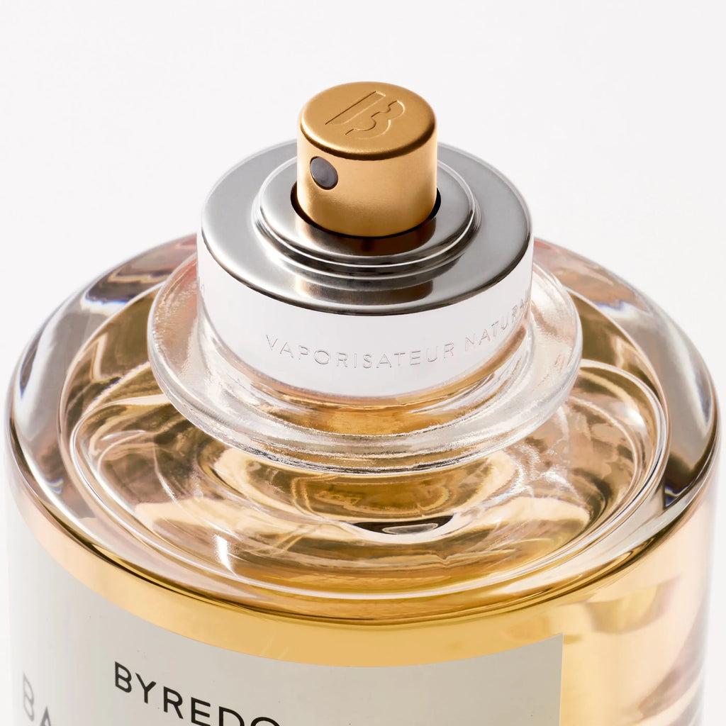 Byredo perfume bottle with gold cap and clear glass body on a white background; Bal d’Afrique Absolu Byredo 50ml woody musk amber perfume