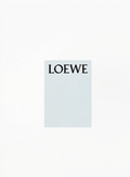 Authentic LOEWE Blue Notebook 21x15cm in elegant blue finish with embossed logo detail — luxury collectible stationery available at Exquisite.