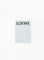 Authentic LOEWE Blue Notebook 21x15cm in elegant blue finish with embossed logo detail — luxury collectible stationery available at Exquisite.