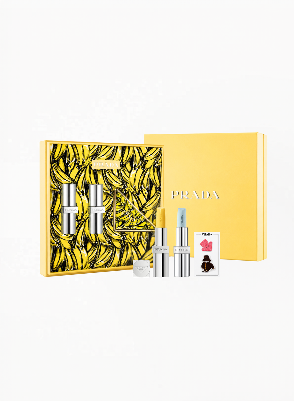 Authentic PRADA Limited Edition Gift Set U001 & U002 featuring luxury beauty essentials, signature banana pattern packaging, and collectible PRADA mirror accessories, available at Exquisite.