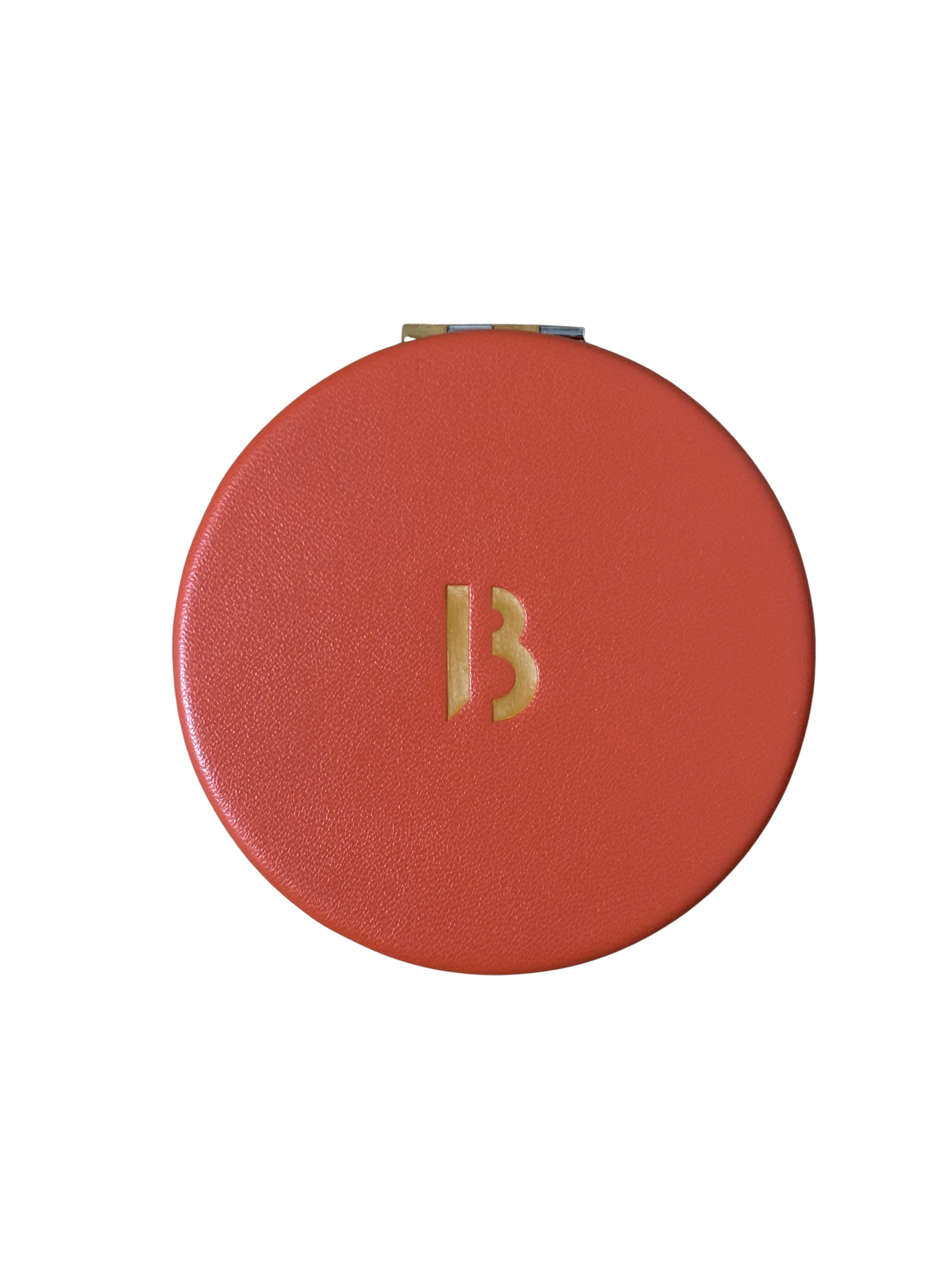 byredo orange compact mirror with a gold 'B' on a white background
