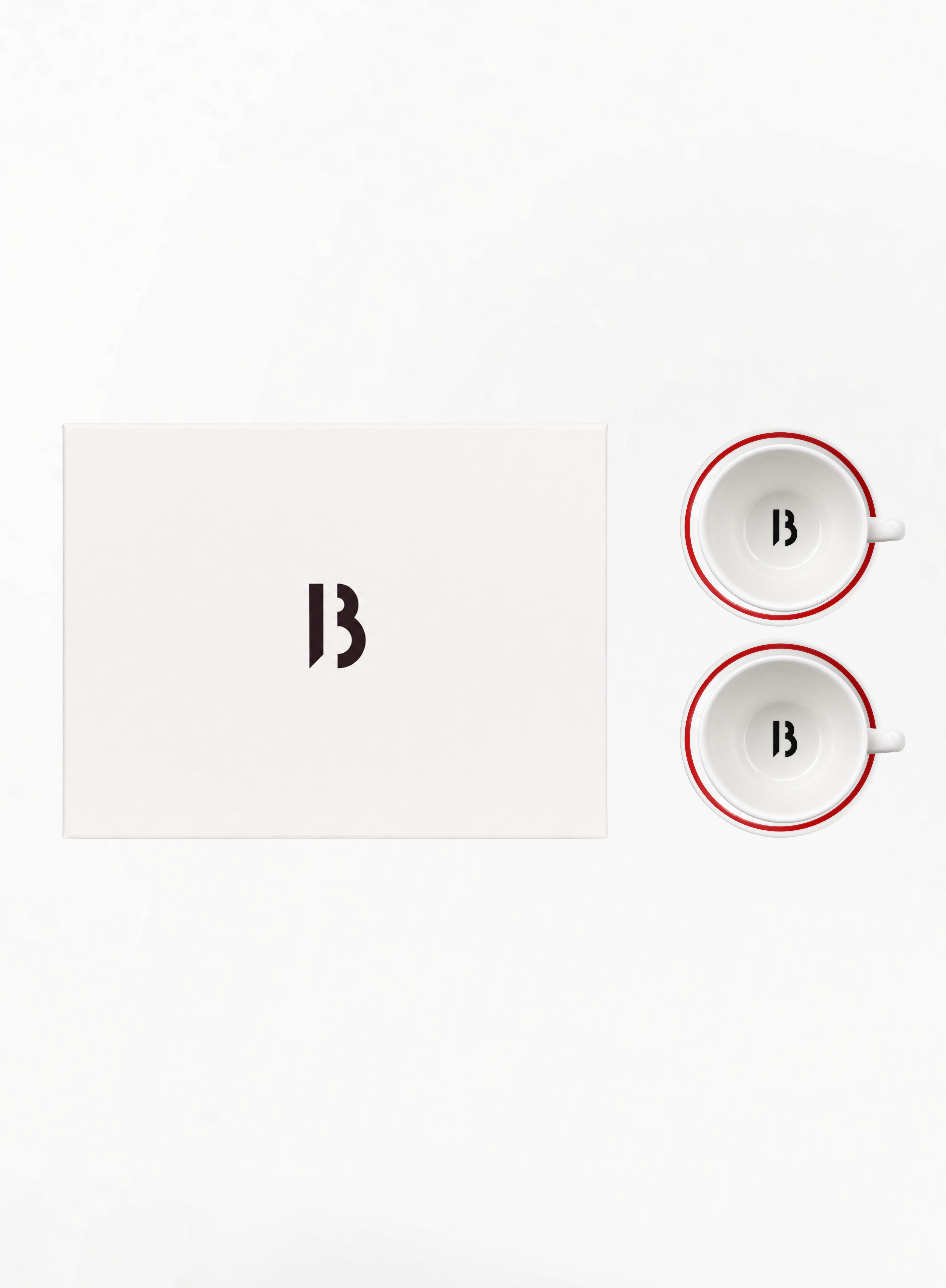 BYREDO Limited Edition tea set for two with ivory ceramic cups, matching saucers, red stripe detailing and signature B monogram