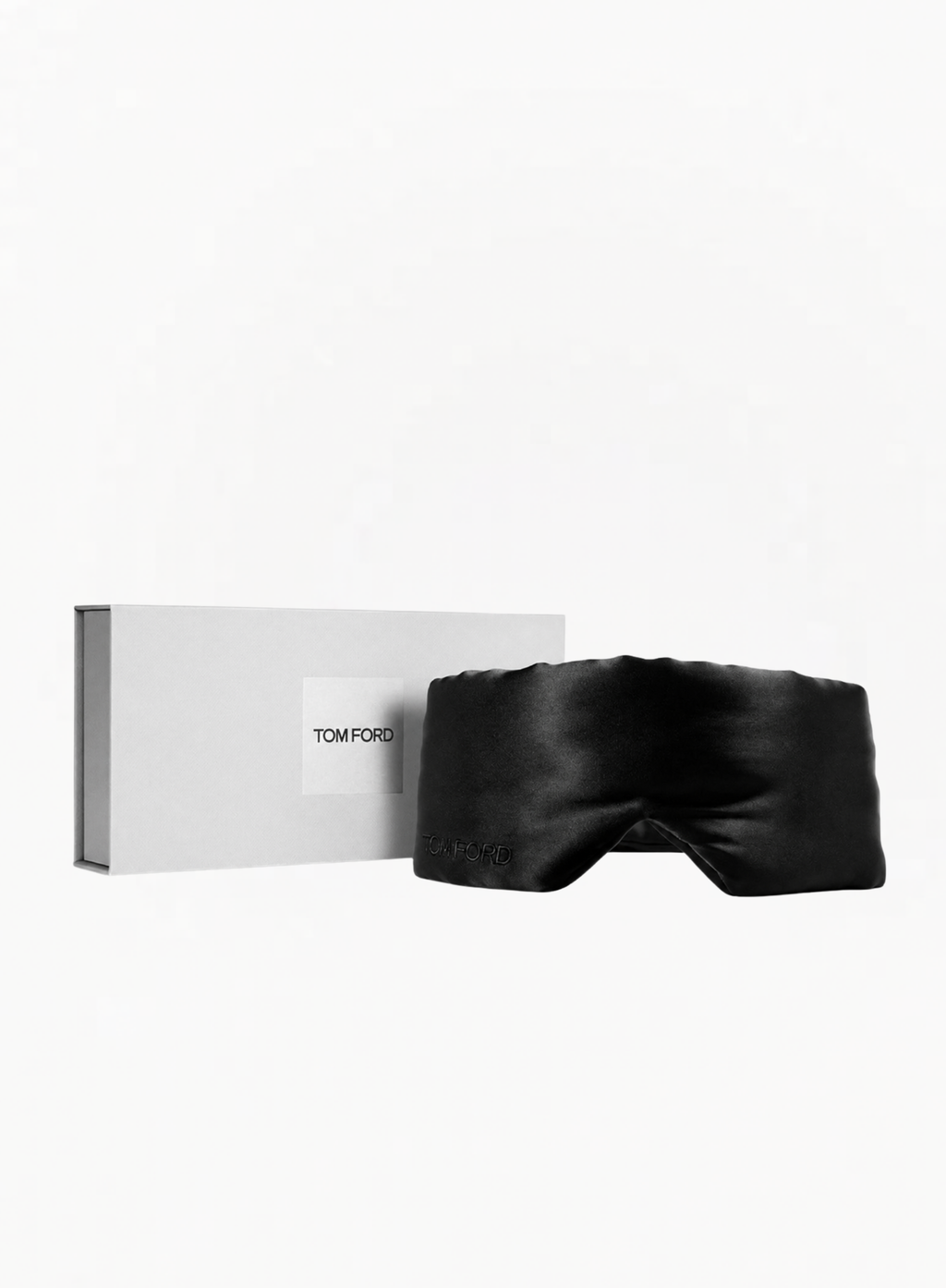 Black TOM FORD luxury sleep eye mask with original TOM FORD presentation box on a white background, available at Exquisite.