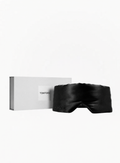 Black TOM FORD luxury sleep eye mask with original TOM FORD presentation box on a white background, available at Exquisite.