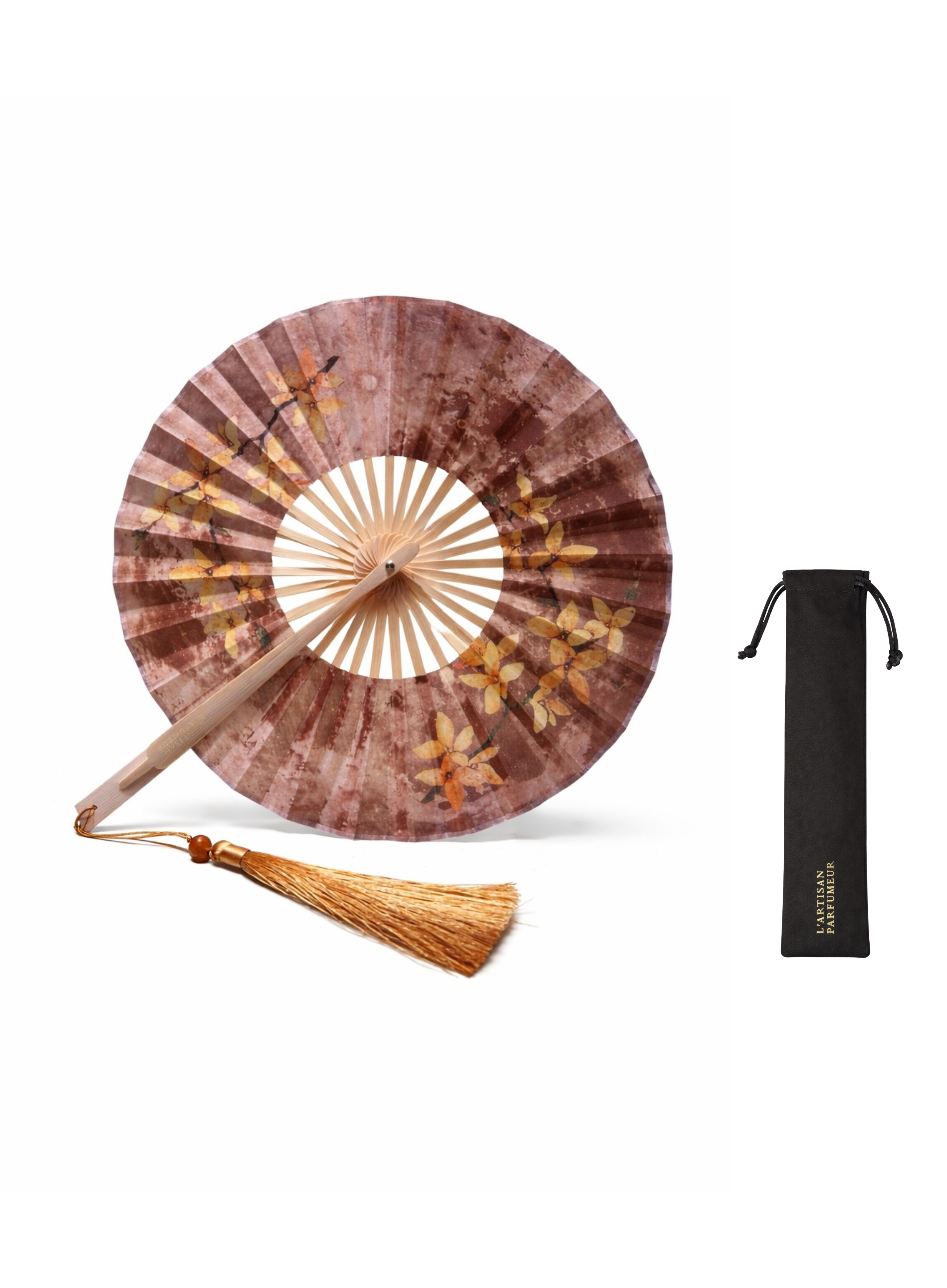L’Artisan Parfumeur wooden hand fan with floral design and black drawstring pouch on a white background
