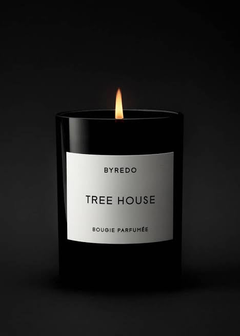 Byredo Tree House candle on a black background