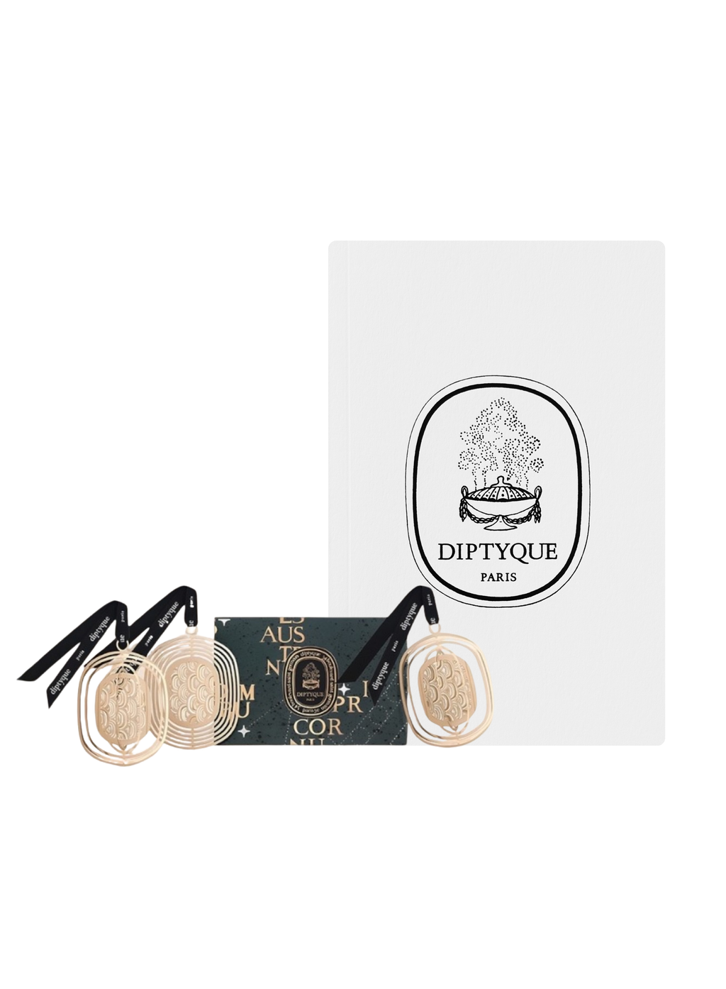 Diptyque ornament trio and scented white notebook set — three gold ornaments, scented notebook and gift packaging, on white background