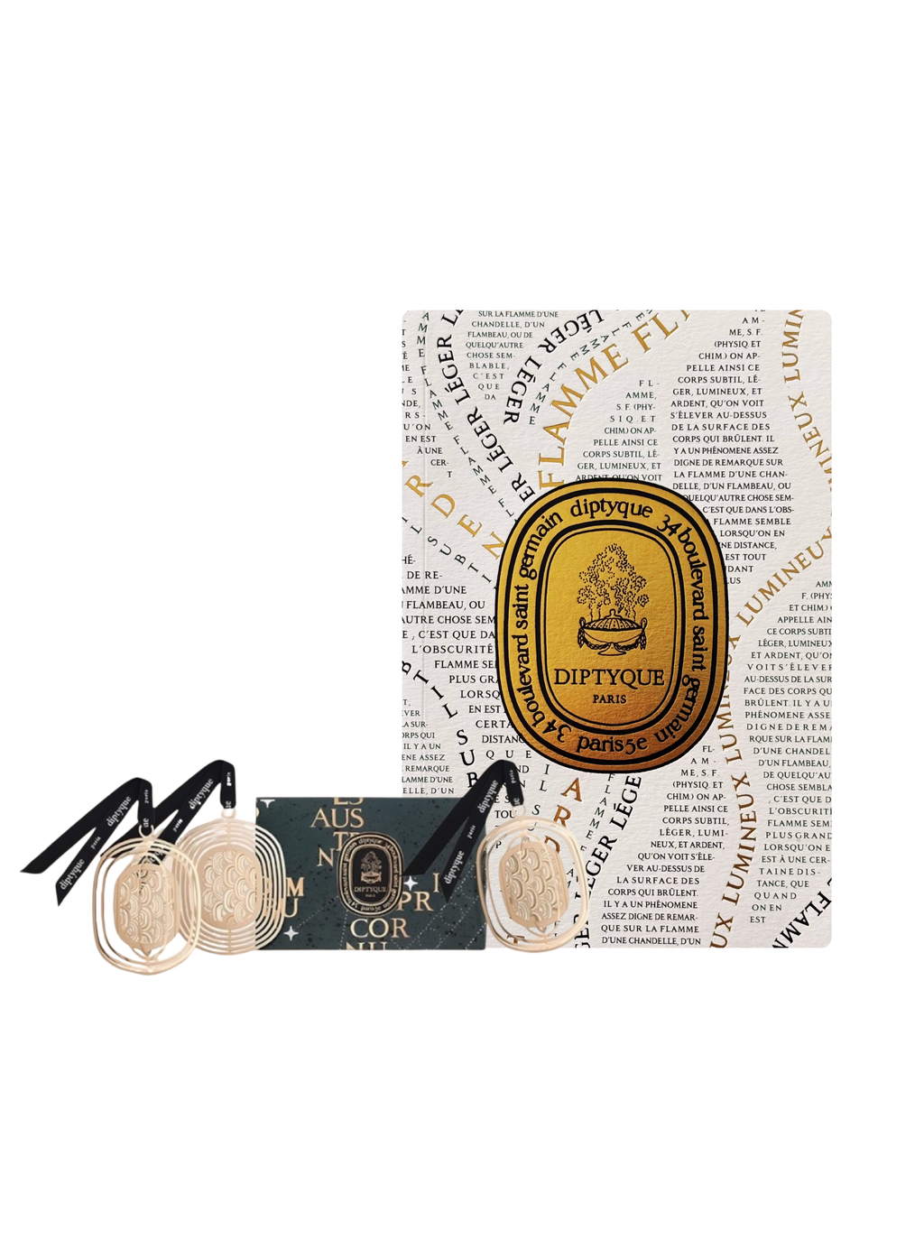 Diptyque decorative ornaments and perfumed notebook with patterned paper packaging on a white background.
