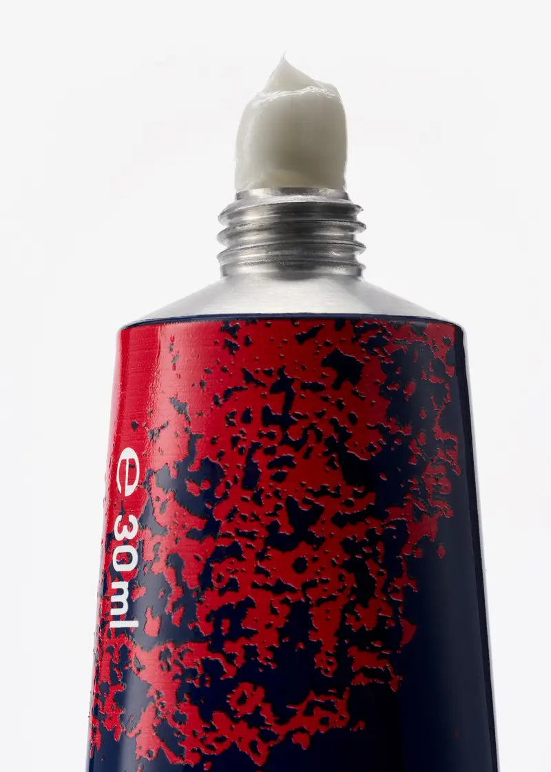 Alt text:
BYREDO Blanche Limited Edition Hand Cream 30ML close-up – creamy texture detail in artistic red and navy packaging. Original BYREDO hand cream at Exquisite.