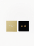 GUERLAIN limited-edition gold-tone bee earrings displayed beside an original GUERLAIN Paris gift box on a white background at Exquisite.