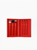 Giorgio Armani red limited edition makeup brush set featuring six brushes inside a red presentation case on a white background, available at Exquisite.