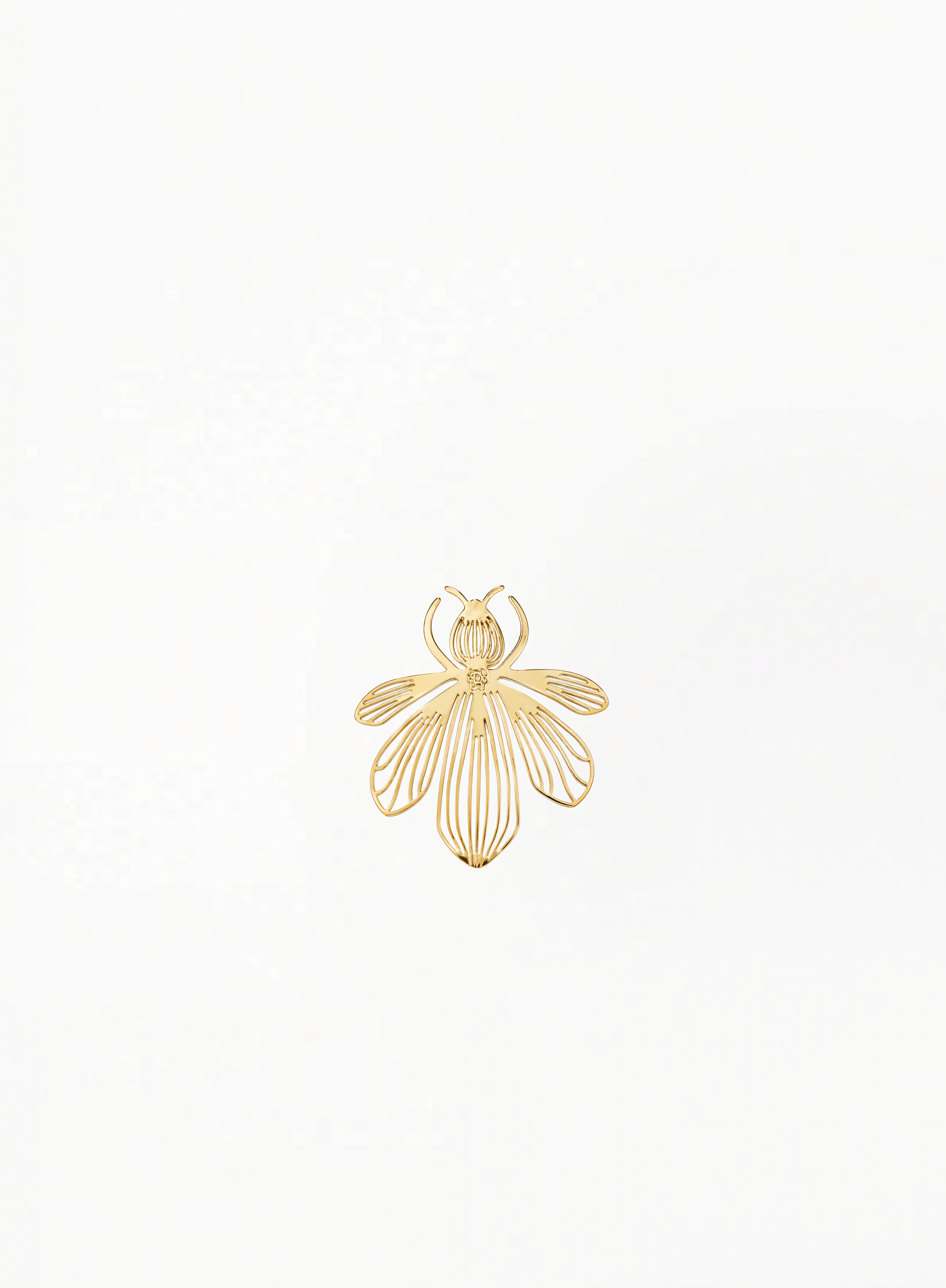 Guerlain gold bee brooch with sculpted striped details, presented on a clean minimalist background with elegant luxury accessory styling and authentic Guerlain-inspired design.