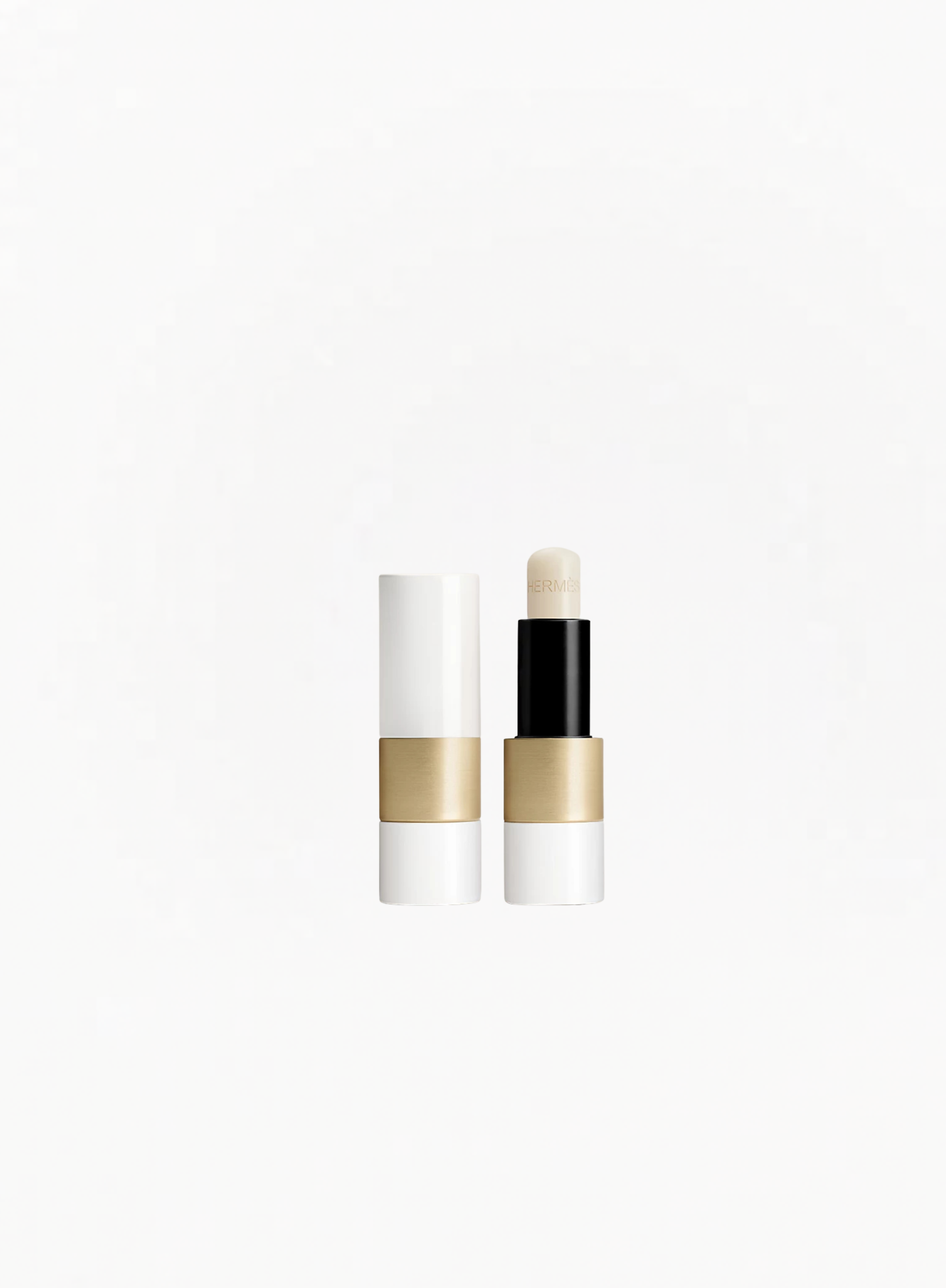 HERMÈS Lip Care Balm in original Hermès orange packaging, luxury nourishing lip balm available at Exquisite.