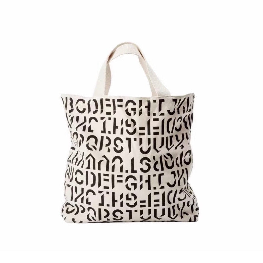 BYREDO 2026 canvas tote bag with black typography print, back view