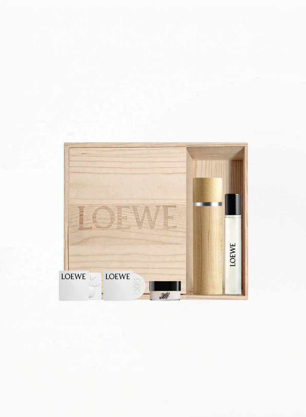 LOEWE Exclusive Wooden Gift Box with LOEWE 001 Eau de Parfum 15ml, two LOEWE 001 Woman Eau de Parfum 1.5ml samples, engraved wooden perfume case, and two ceramic scented soaps, available at Exquisite.
