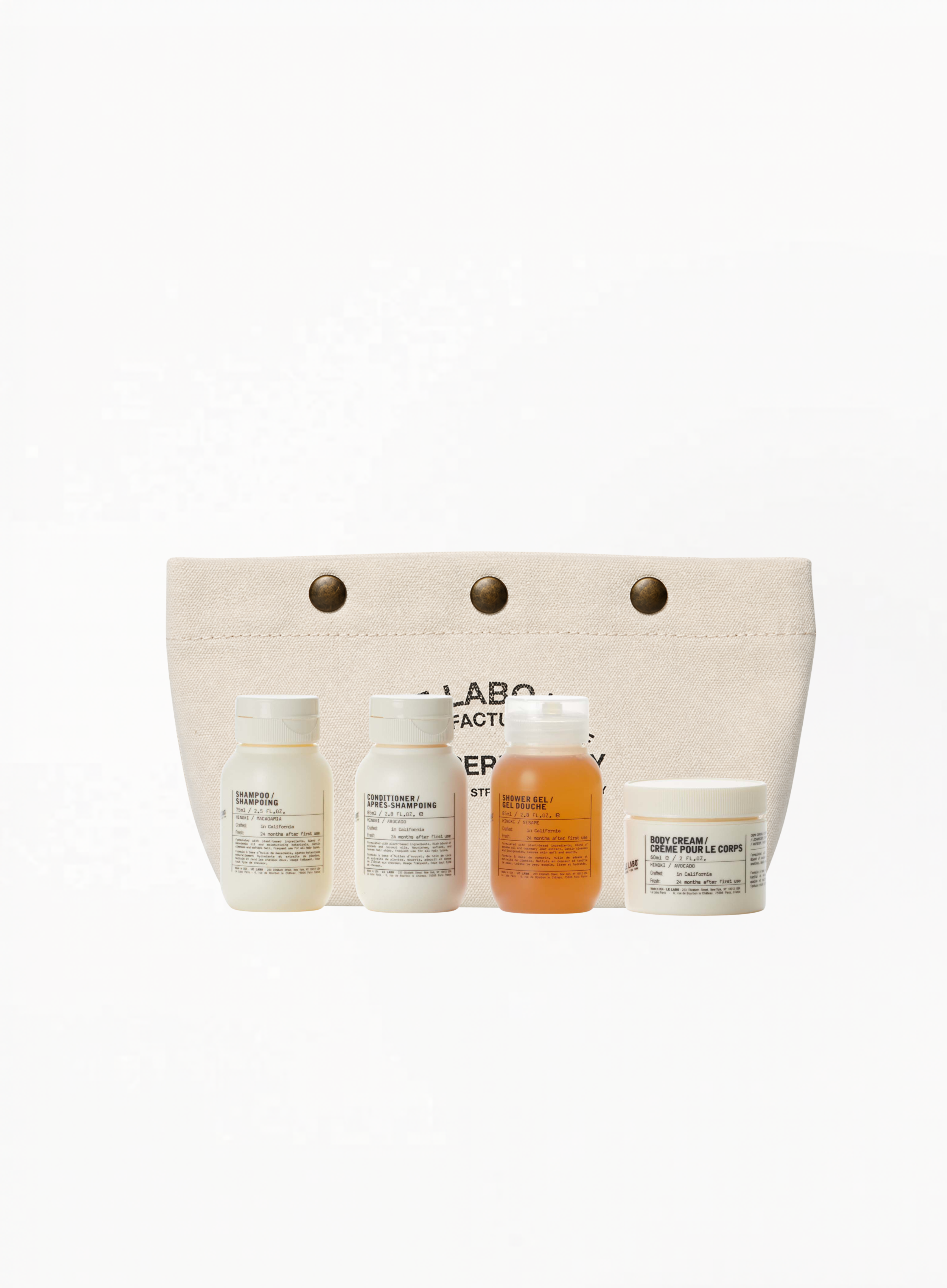 Le Labo Hinoki travel set with shampoo, conditioner, shower gel and body cream, authentic luxury travel care set available at Exquisite.
