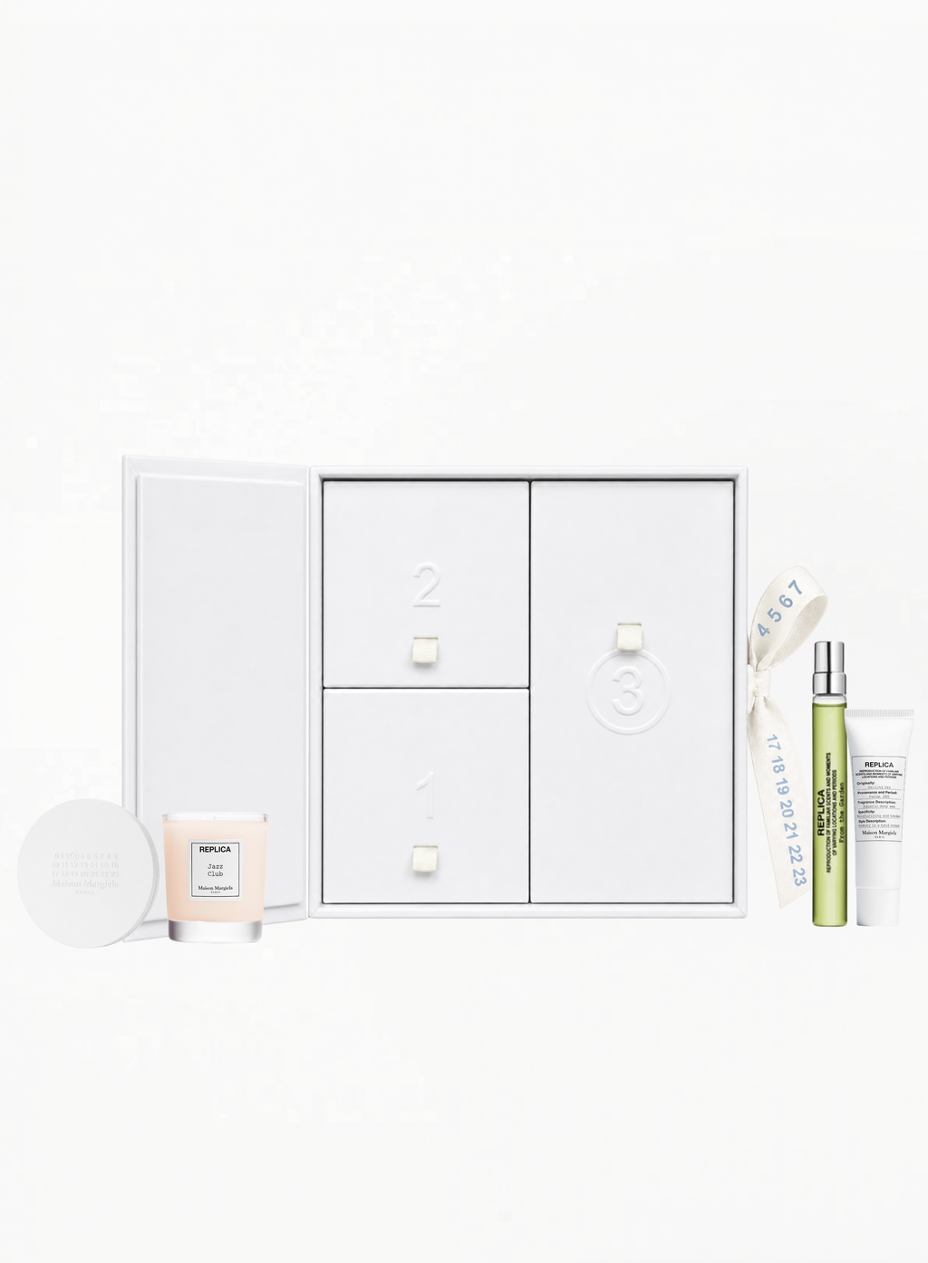 Maison Margiela Replica limited edition set with Jazz Club 30g home candle, From the Garden Eau de Toilette 10ML, round mirror and Sailing Day hand cream 15ML, curated by Exquisite.