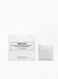 Maison Margiela Replica perfumable matte ceramic diffuser with embossed logo and white cord, presented with its original box at Exquisite.