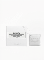 Maison Margiela Replica perfumable matte ceramic diffuser with embossed logo and white cord, presented with its original box at Exquisite.