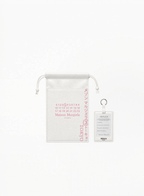 Maison Margiela Springtime in a Park Exclusive Tokyo Collection pouch with matching Replica keychain tag, authentic Maison Margiela accessory set available at Exquisite.