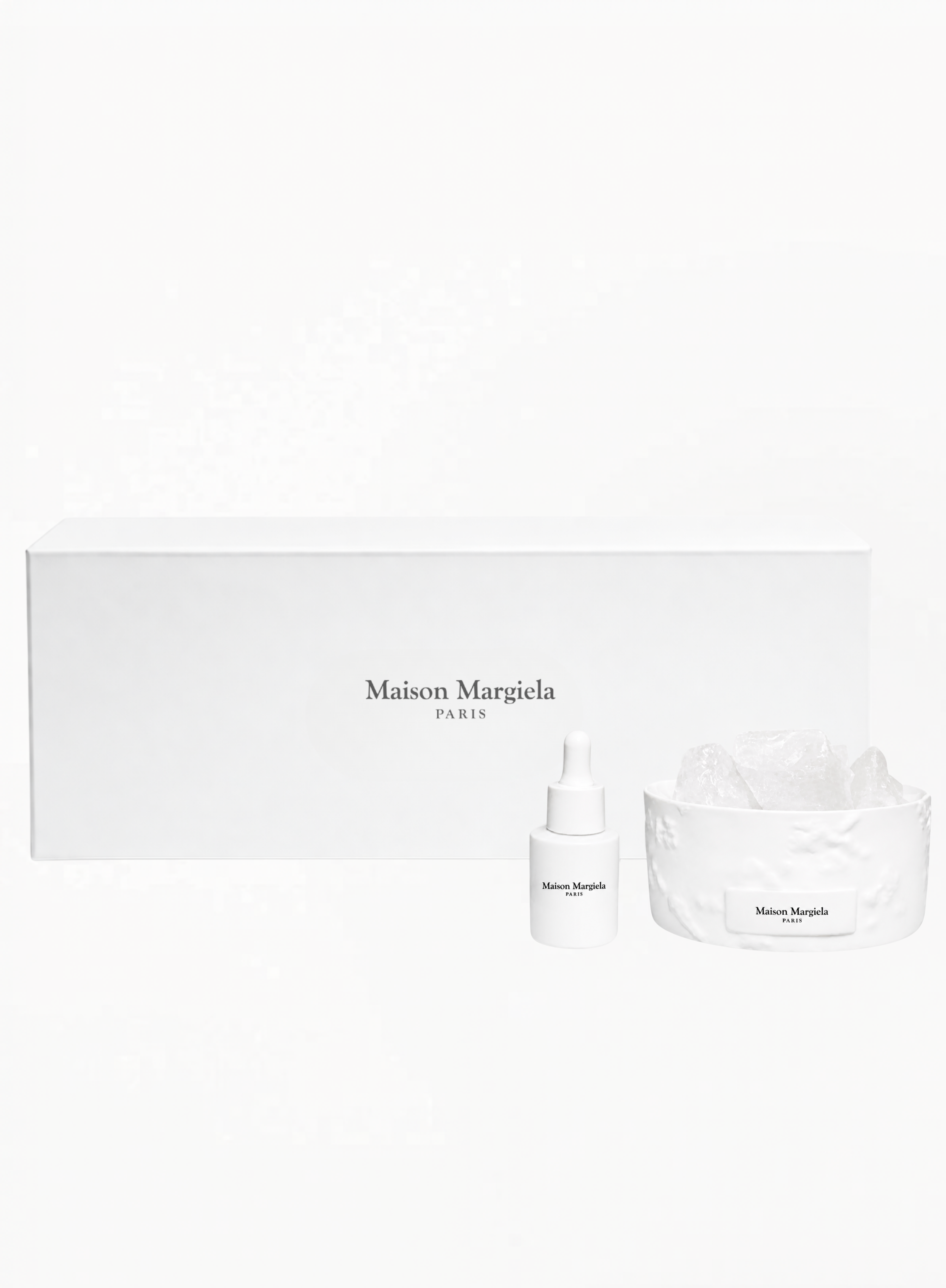 Maison Margiela Stone Diffusion Limited Edition Set with white stone diffuser and fragrance bottle on a clean white background, available at Exquisite.