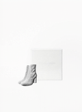Maison Margiela Tabi Boots limited edition magnet with signature split-toe design, available at Exquisite.