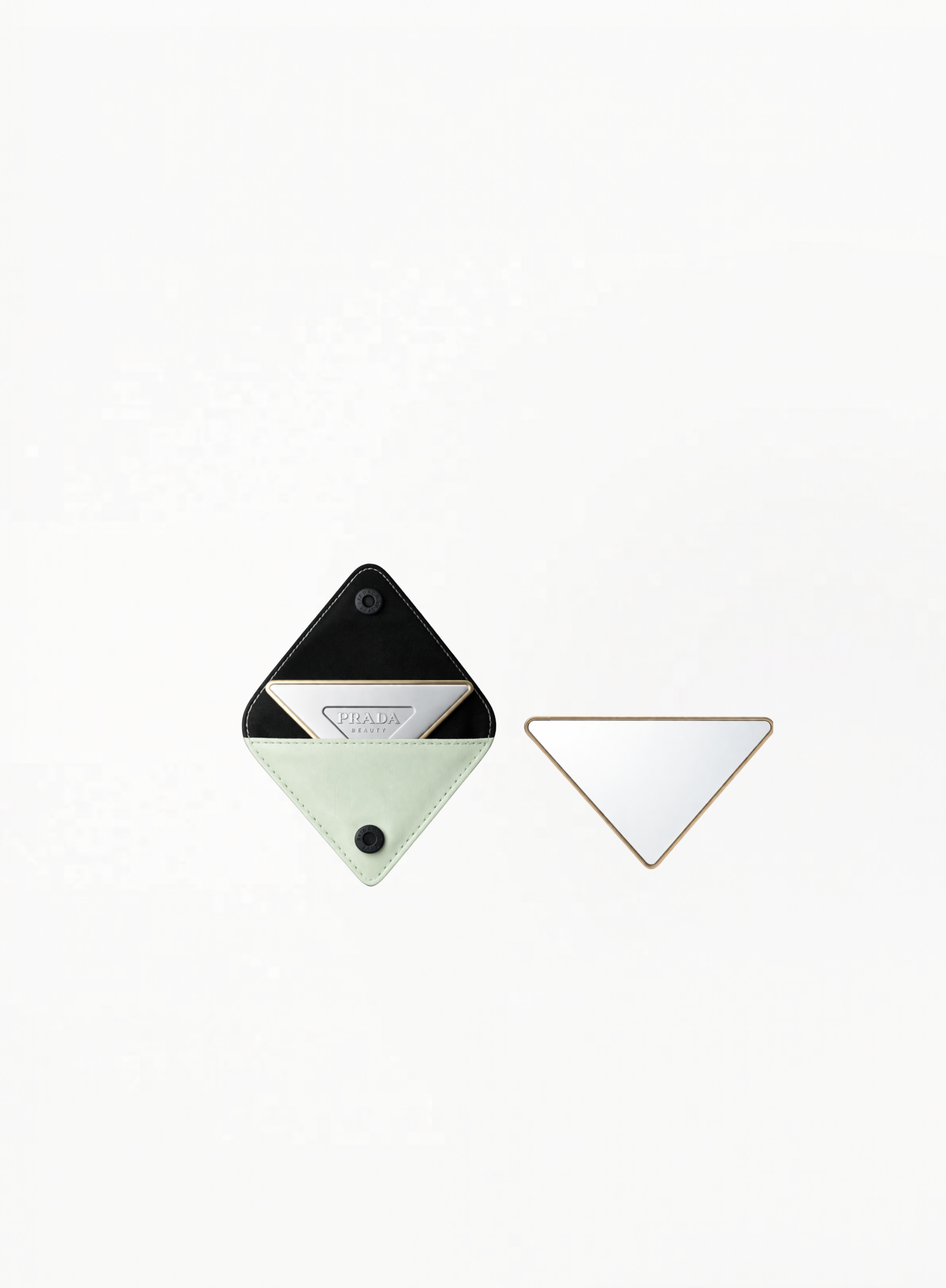 PRADA green mirror with compact glossy design on white background.