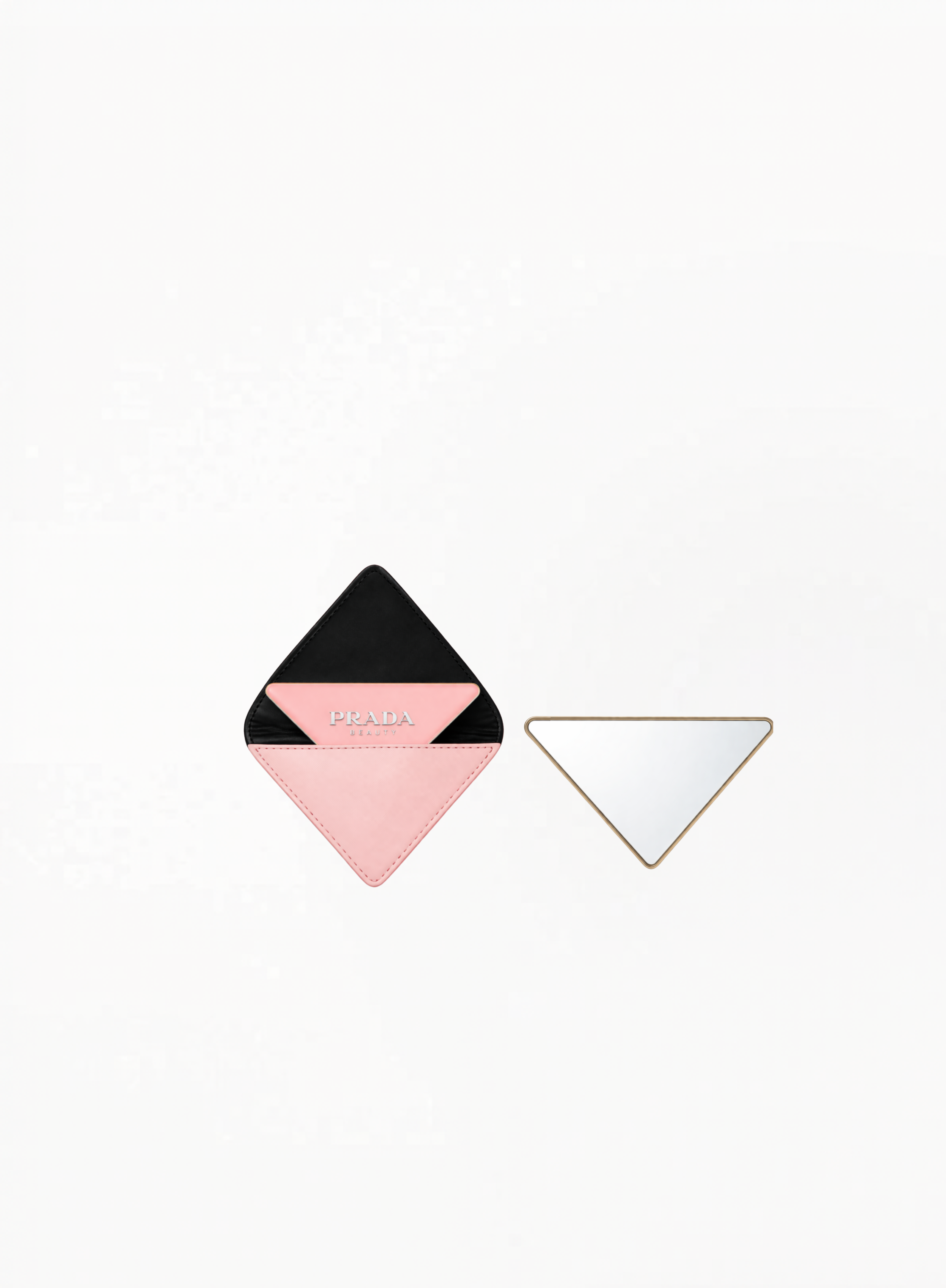 PRADA pink mirror with compact glossy design on white background.