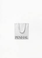 Penhaligon’s Canvas Tote Bag in white with elegant branded design and minimalist luxury aesthetic on a clean white background for Exquisite.