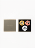 Penhaligon’s Collectible Badge Trio Gift Set featuring three collectible branded badges in a luxury presentation, designed as a playful limited edition accessory set by Exquisite.