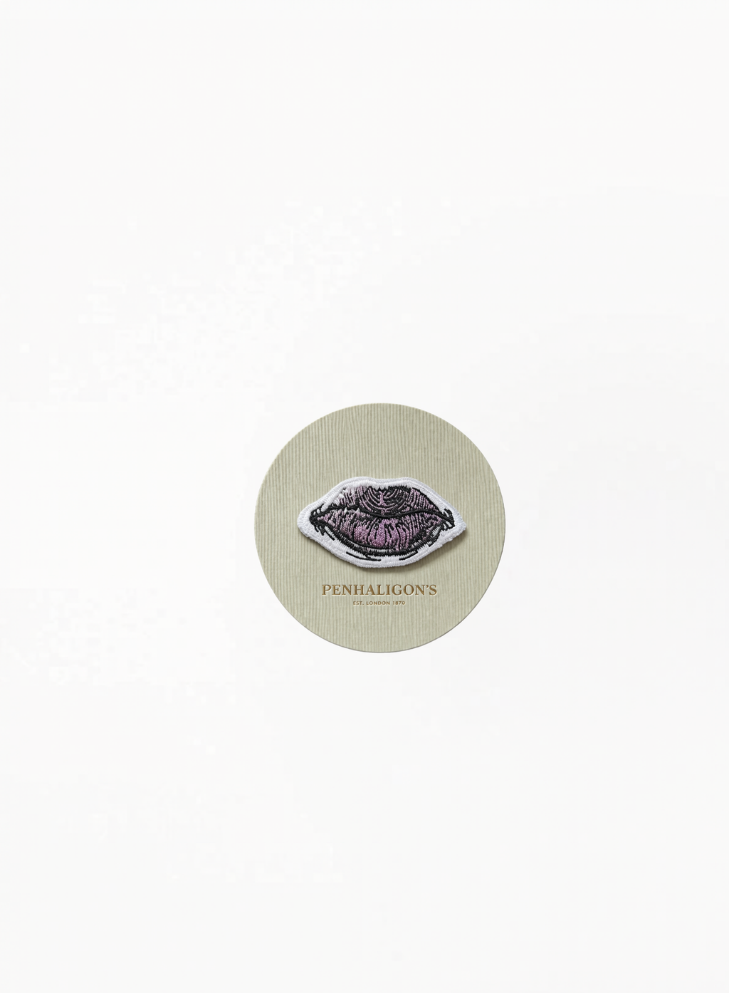 Penhaligon’s decorative accessories brooch with elegant branded detailing on white background