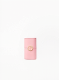 Pink cylindrical Giorgio Armani fragrance case with gold logo detail on a clean white background, photographed front-facing in a minimal luxury style.
