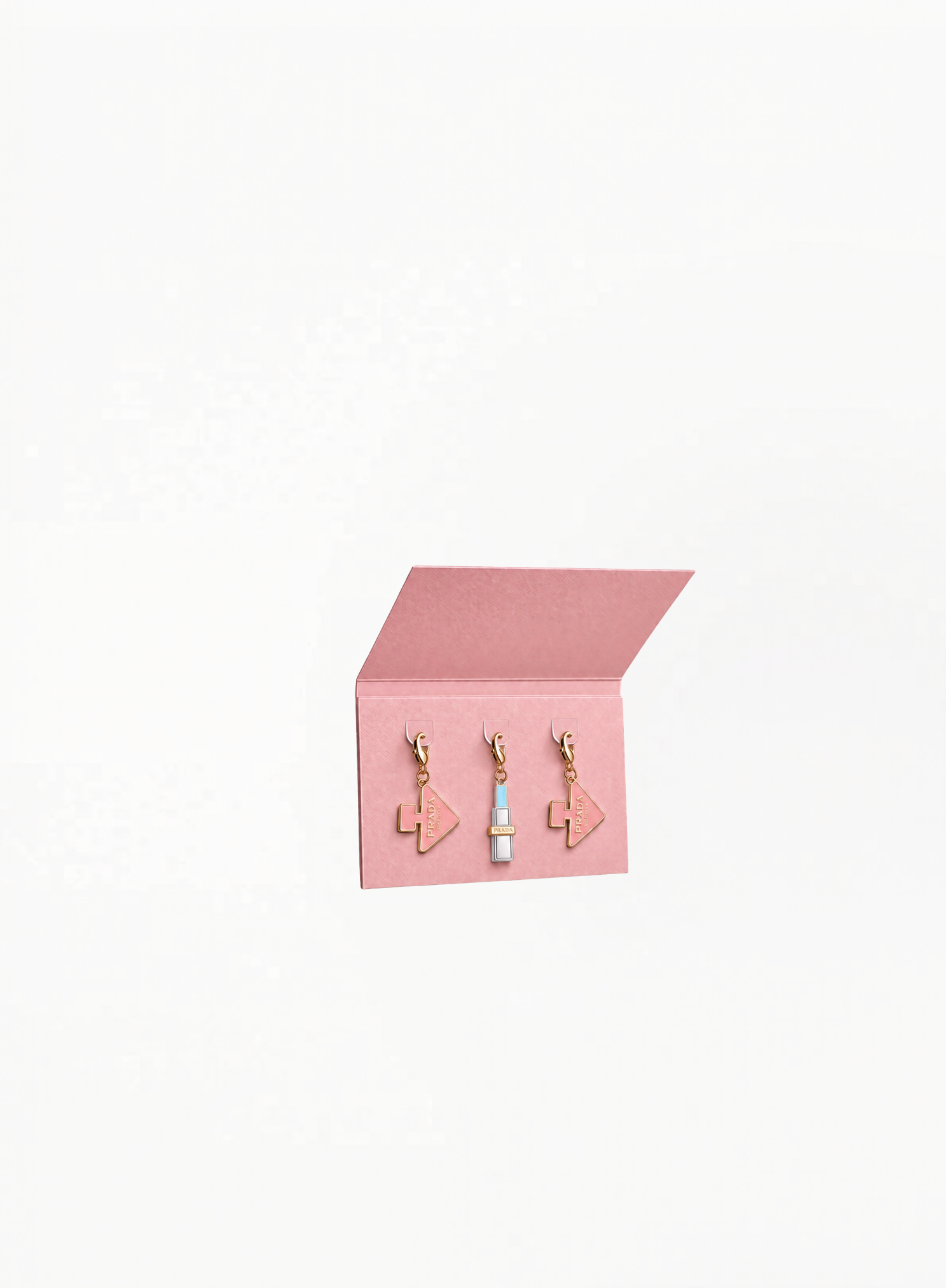 Prada Beauty Charms Pink accessory in glossy silver-tone metal with pastel sky blue lipstick-inspired detail, photographed on a clean white background for Exquisite.